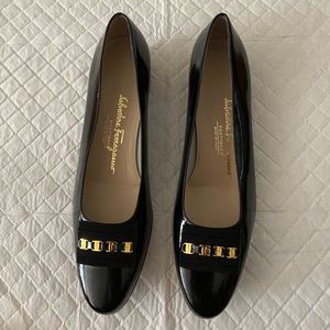 Salvatore Ferragamo black patent leather flats.